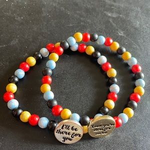 Friends matching multicolor bracelets for BFFs.